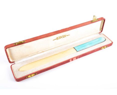 An early 20th century ivory letter opener, with pale blue guilloché enamel handle, in fitted case, 22 cm.Condition report: No