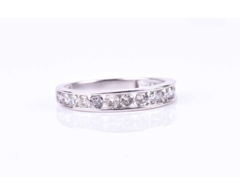 A white gold and diamond half eternity ring, channel-set with round brilliant-cut diamonds of approximately 0.65 carats combi