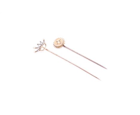 A 19th / 20th century yellow metal and pearl stick pin in the form of a crown (lacking two pearls), and a smaller stick pin s