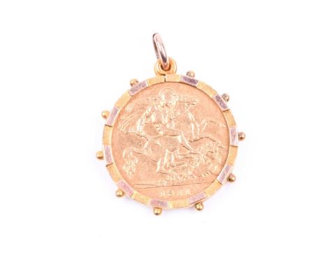 A George V half-sovereign, 1911, bare head l. R. St. George and dragon, in a 9ct gold pendant mount, 5.4g combined weight.