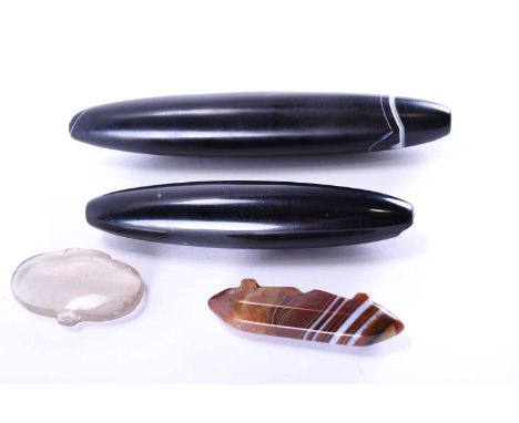 Two large polished agate oval pendants, principally black in colour with fine white and brown bands, an octagonal banded agat