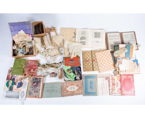 A quantity of 19th century and later lacemaking tools housed in a wooden trunk together with a box of handmade lace, a tin of