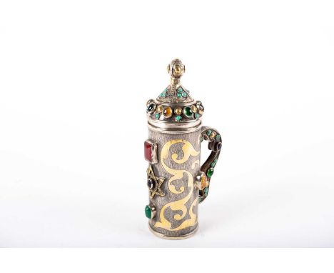 Judaica, a silver and gem set lidded tankard, 19th /20th century, the domed lid with ball finial with gilt roundels above tur