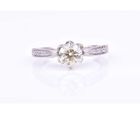A diamond solitaire ringset with a round brilliant-cut diamond of approximately 1.23 carats, approximate colour L/M (light ye