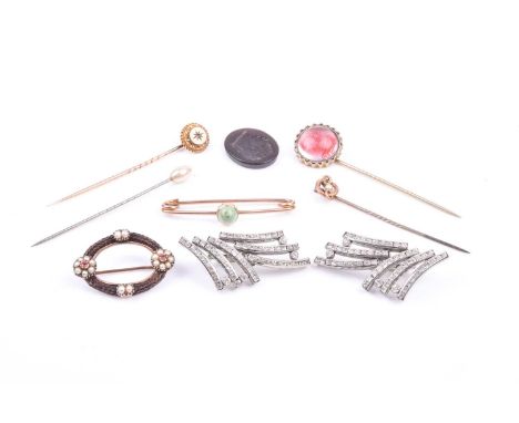 A small group of antique jewellery, to include a yellow metal and plaited hair brooch with pearl and red stone floral cluster