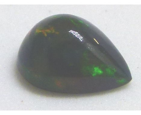 Pear cabochon black opal, approximately 0.97ct, 8.70 x 6.67 x 4.17 mm 
