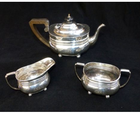 Edwardian silver three piece tea set, branded decoration with monogram set on ball feet, teapot, approx. 14cm h, Birmingham 1