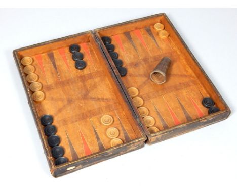 A hinged tan leather chess and backgammon board modelled as a pair of books, 'History of England', 50cm w