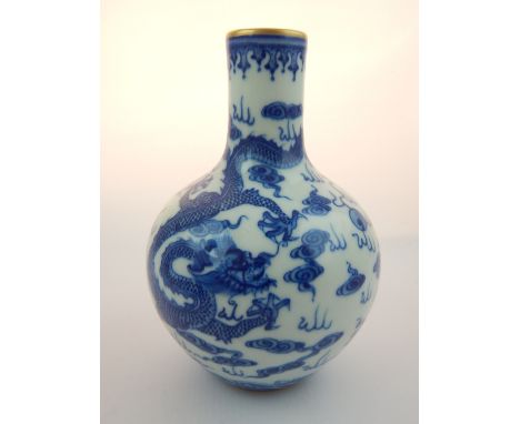 Chinese globular posy vase, turquoise internal glaze, all over blue and white decoration of dragons chasing a flaming pearl, 