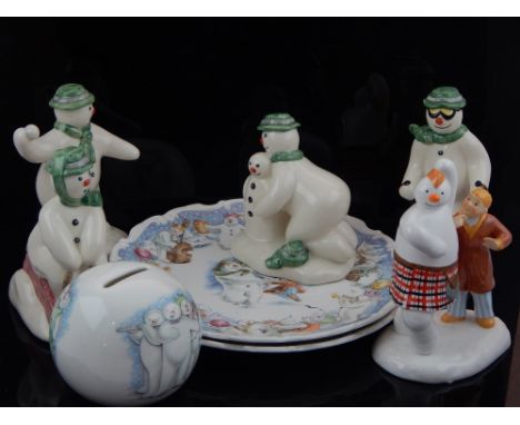 Snowman collection; Royal Doulton DS20 Tobogganing, DS21 Skiing, DS22 Snowballing, money bank and plates, and a Spode Highlan