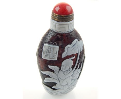 Peking glass snuff bottle, cameo carving of children playing, red jade cabouchon to stopper, 8.8cm h
