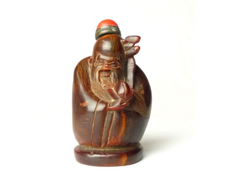 Chinese snuff bottle, horn carved in the form of a sage, red jade cabouchon top, 8cm h