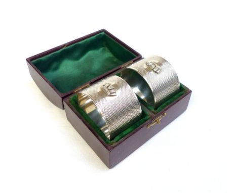 Boxed pair of serviette rings, Sheffield 1938, engine turned and bearing a coronet, 92g 