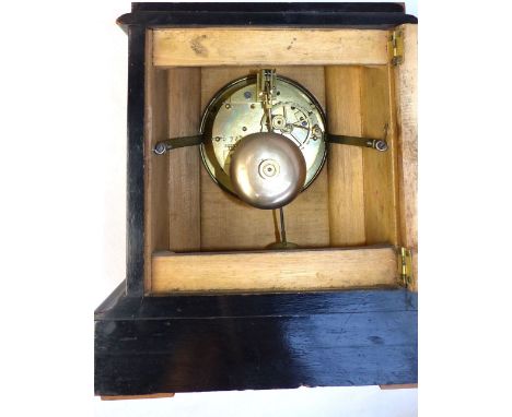 Early 20th C French walnut mantel clock, eight day movement, white enamel dial with Roman numerals, architectural case on bra