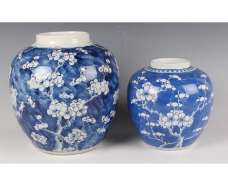 A Chinese blue and white porcelain ginger jar, mark of Kangxi but late 19th century, painted with blossoming prunus branches,