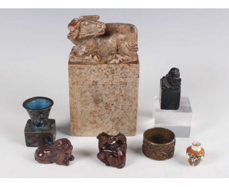A small group of South-east Asian collectors' items, 19th century and later, including a Japanese carved hardwood horse and f