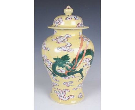 A Chinese yellow ground porcelain jar and cover, 20th century, the baluster body painted with a green dragon and polychrome v