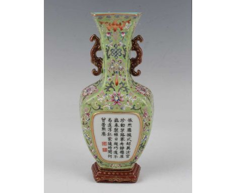 A Chinese famille rose enamelled and calligraphic pea green ground porcelain wall vase, mark of Qianlong but modern, the body
