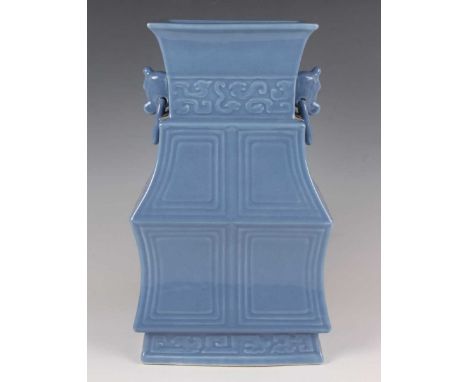A Chinese archaistic blue glazed porcelain vase, probably late Qing dynasty, of rectangular baluster form with panelled sides