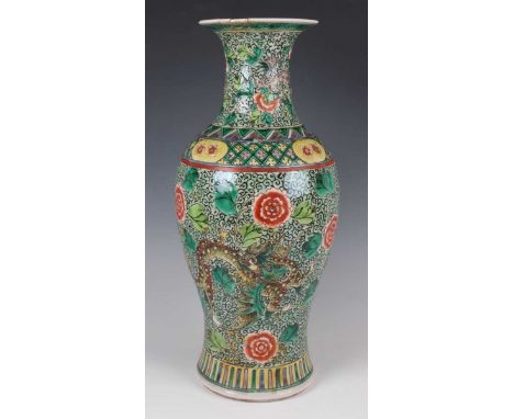 A Chinese famille verte porcelain vase, late 19th century, the baluster body and flared neck painted with dragons and peony o