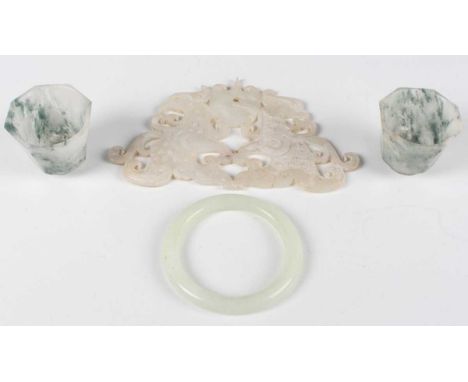 A Chinese pale celadon jade bangle, 20th century, inside diameter 5.3cm, together with an archaistic jade carving, length 14c