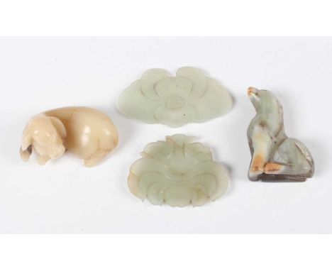 A Chinese jade kylin pendant, late Qing dynasty, modelled in a seated pose, the stone of variegated green tone, height 4.8cm,