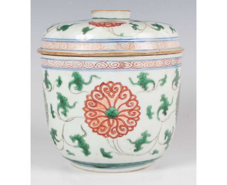 A Chinese famille verte porcelain jar and cover, Kangxi period, the 'U' shaped body and domed cover painted with a uniform de