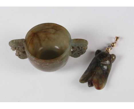 A Chinese carved jade cicada pendant, 20th century, with carved and incised decoration, 5.5cm, with gold bead and suspension 