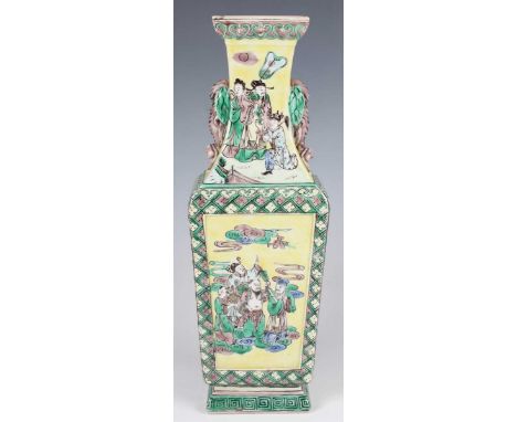 A Chinese famille verte yellow ground enamelled biscuit porcelain vase, Kangxi style but late 19th century, the square taperi