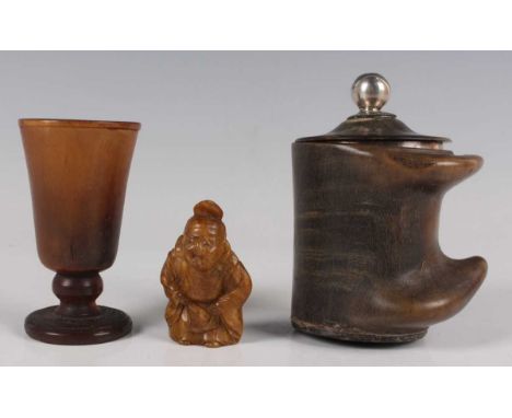 A rhinoceros horn small goblet, probably 18th century, the rounded funnel shaped bowl on a knop stem and circular foot, heigh
