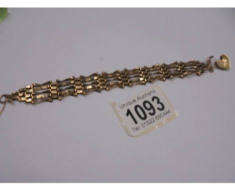 A 9ct gold gate bracelet with padlock (safety chain broken). 9.9 grams.