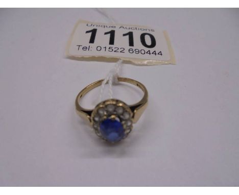 A gold cluster ring, size N half, 2.4 grams.