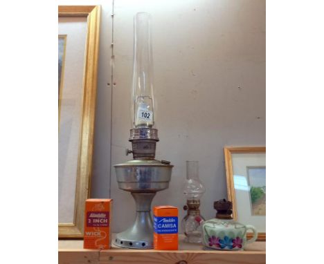 A Victorian glass finger oil lamp &amp; 1 other 7 an Aladdin paraffin lamp. COLLECT ONLY