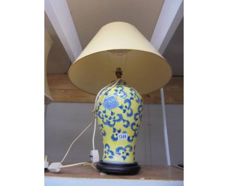 An oriental ceramic table lamp with shade. COLLECT ONLY.