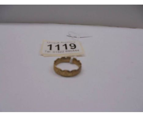 A unmarked ring (tests as 9ct) size p, 2.8 grams.