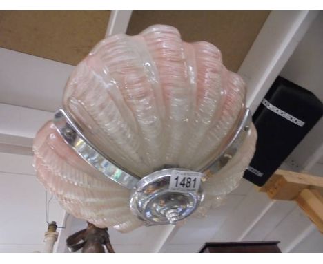 An art deco clam shell ceiling light.