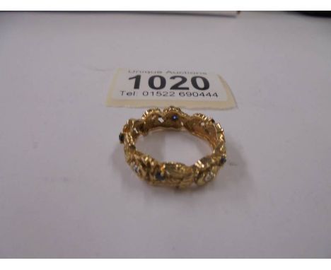 A gold ring set diamond and sapphires, marked 385, size S, 6.1 grams.