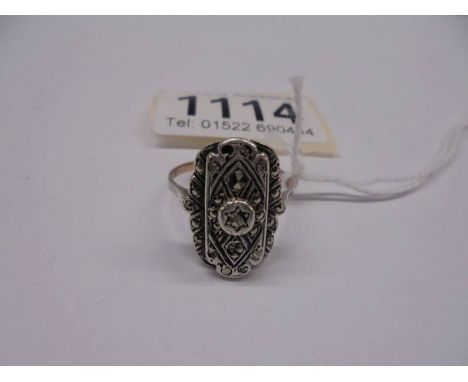 A 9ct gold and silver marcasite ring, size T.
