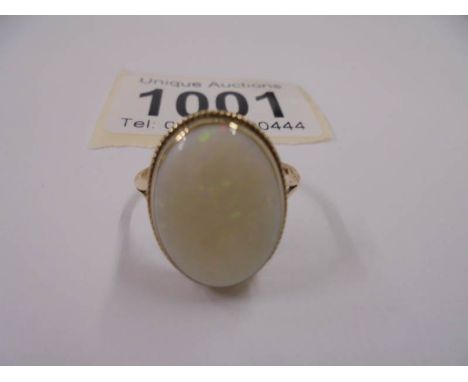 A yellow gold ring set large genuine opal, size Q, 2.6 grams.Opal dimensions 15mm x 12mm