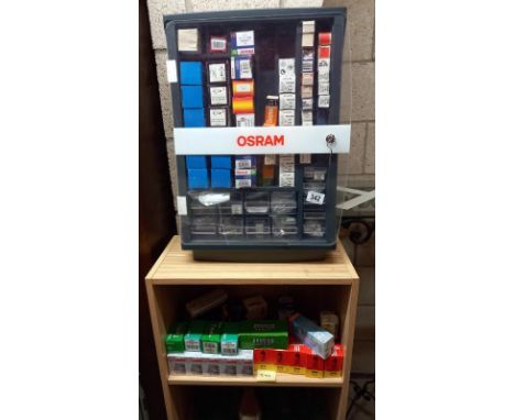 A vintage garage Osram car light bulb shop display cabinet and varied selection of boxed bulbs