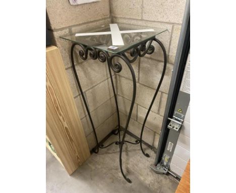 A tall glass topped wrought iron lamp/plant stand height 110cm, slight chip to edge of glass (COLLECT ONLY)