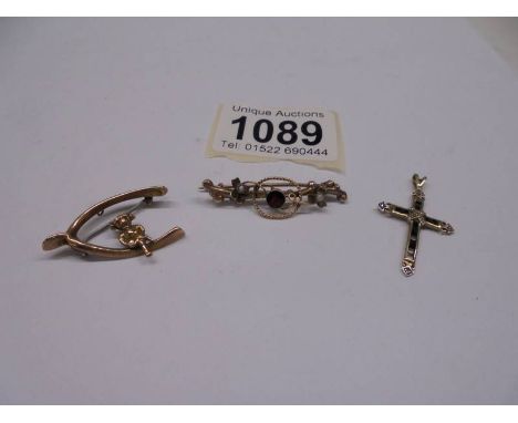 A gold garnet and seed pearl brooch, a Lincoln Imp brooch and an a/f gold cross, 4 grams.