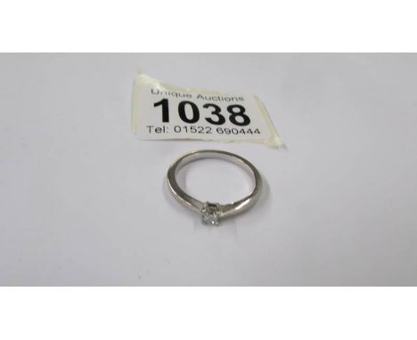 A platinum diamond solitaire ring, size O half, 2.6 grams.