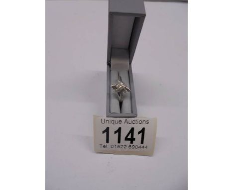A diamond crossover ring in 9ct white gold stamped.Weight 19gms.Size K & 1/2