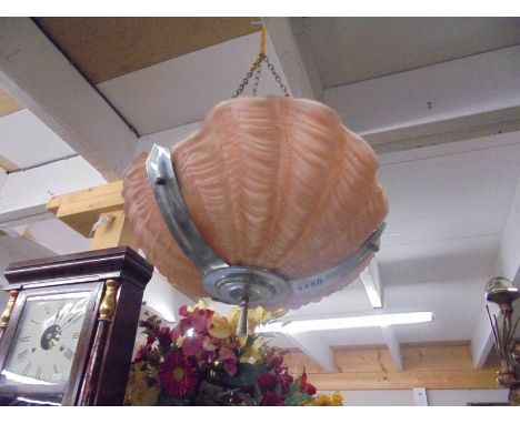 An art deco clam shell ceiling light.