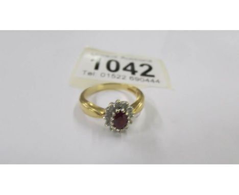 A 9ct gold cluster ring, size N half, 4 grams.