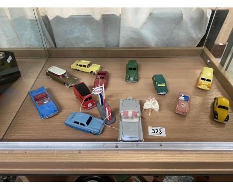 A good selection of unboxed Atlas dinky toys including Corgi, Marilyn Monroe figure, Ford &amp; Thunderbird