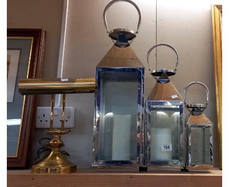 A set of 3 graduated candle lanterns &amp; a brass bankers lamp. COLLECT ONLY