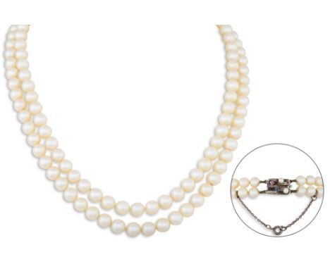 A SET OF VINTAGE DOUBLE STRANDED CULTURED PEARLS, to a 14ct gold clasp set with pearl, ruby and sapphire