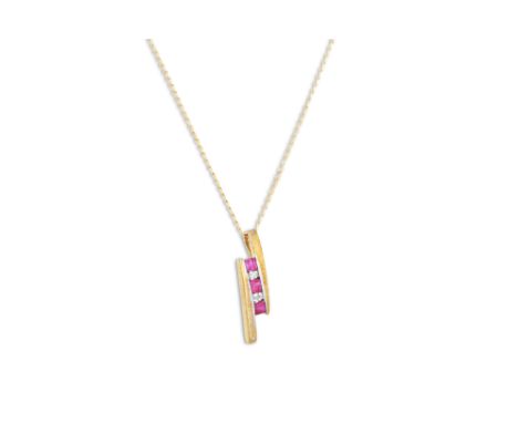 A RUBY AND DIAMOND PENDANT, mounted in 9ct yellow gold, on a chain